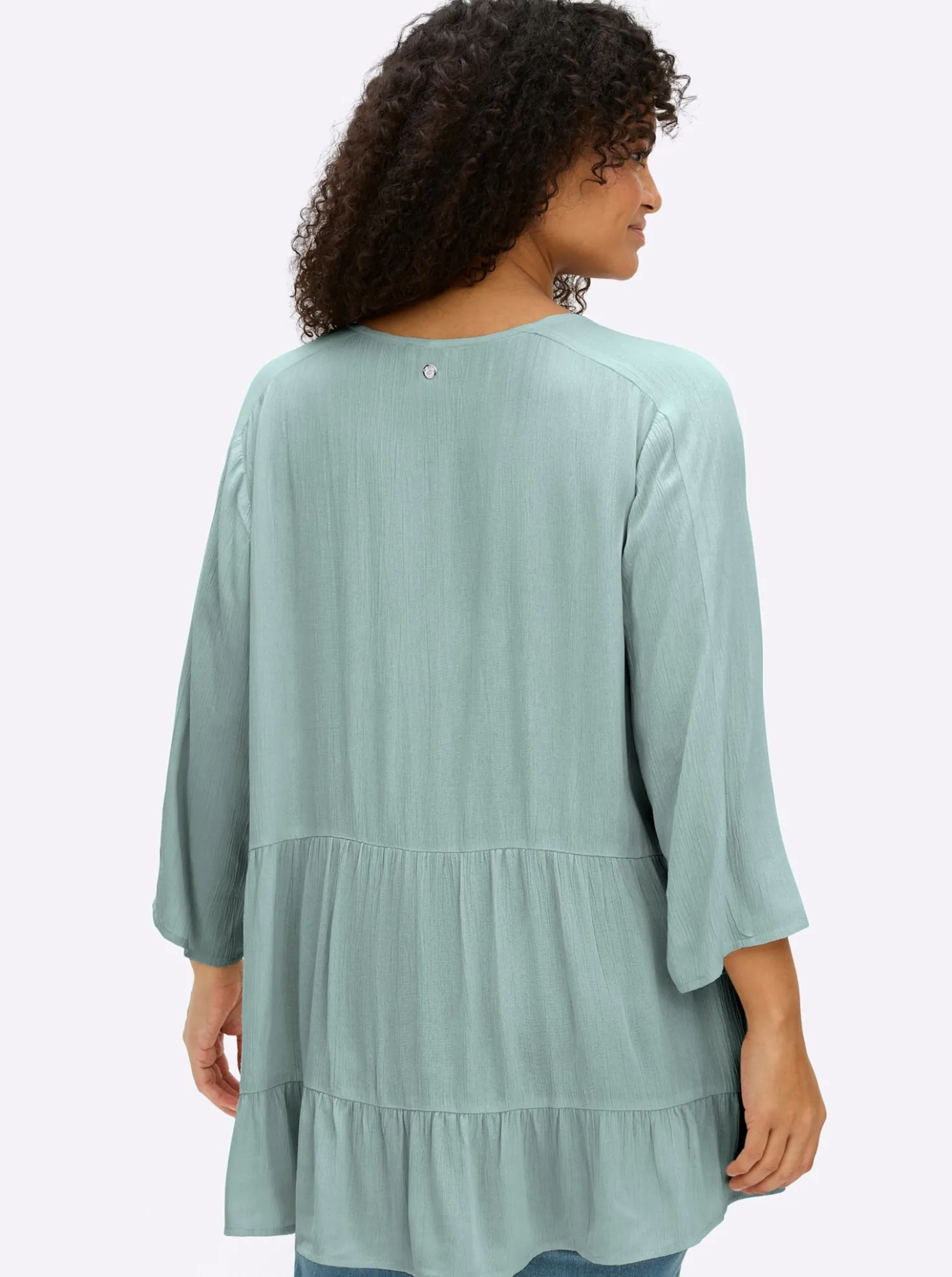 Crinklebluse mit Volant am Saum