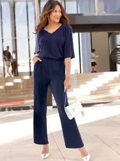 Jumpsuit mit Spitze am V-Ausschnitt