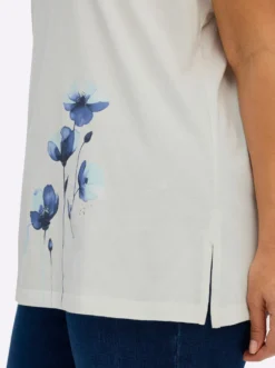 Rundhalsshirt mit Blütenprint am Saum