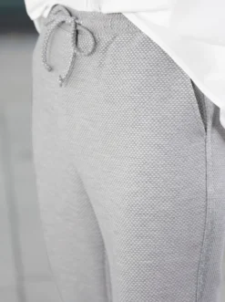 Schlupfhose mit silberfarbenen Galonstreifen